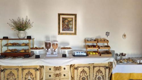 a table with bread and other food items on it at Locanda Adele in Parghelia