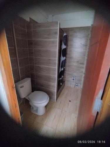 a small bathroom with a toilet in a room at Tampu Machi Eco Camping in Chancayllo