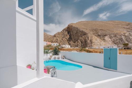 a view from the balcony of a villa with a swimming pool at ALMA THERA Boutique Hotel in Perissa