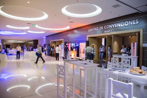 a group of people walking around a shopping mall at Gala Hotel y Convenciones in Resistencia