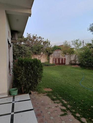 an outside view of a yard with a house at Shree Govindam kunj Villa in Jaipur