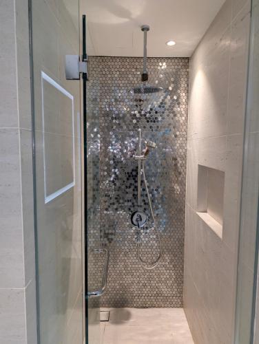 a shower with a glass door in a bathroom at Star Residence 2br Unit Floor 46 in Kuala Lumpur