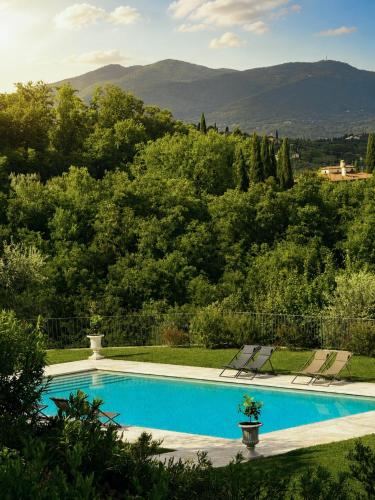a swimming pool with a view of a mountain at Podere di Montecchio - Le Andane in Tavarnuzze