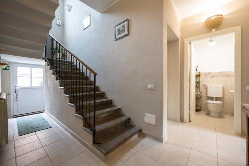 a hallway with a staircase in a home at B&B Benvenuto in Venegono Superiore