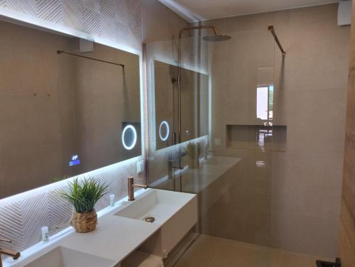 a bathroom with a sink and a mirror at Belver Porto Dona Maria Resort in Luz