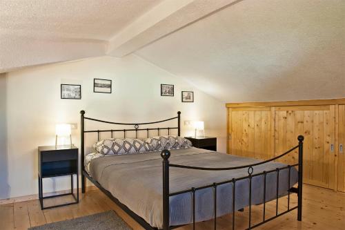 a bedroom with a bed and two night stands at Casa Mia apartment in Vodnjan