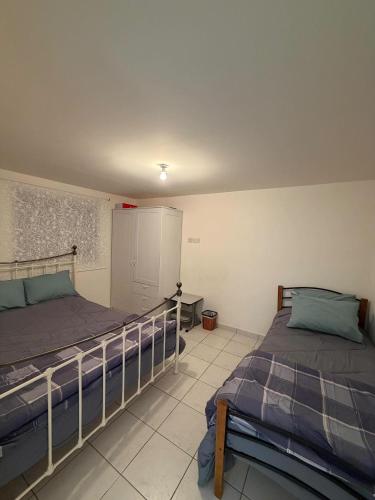 a bedroom with two beds in a room at Indie little house in Limassol