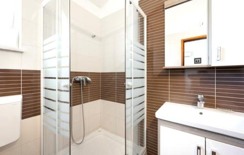 a bathroom with a shower and a sink at Apartments Bašić Pirovac - Sea view - Small and large groups in Pirovac