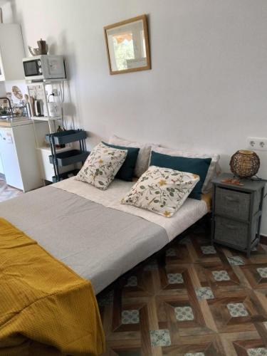 a bed with two pillows on it in a room at Finca Indalopez in Tabernas