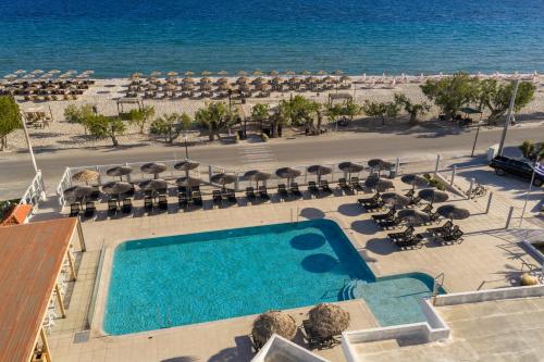 an overhead view of a swimming pool and the beach at Akti Dimis Hotel in Tigaki