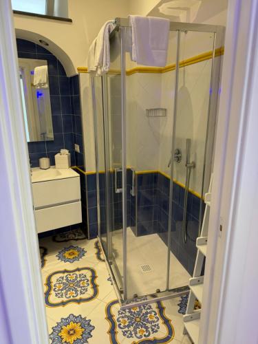 a bathroom with a shower and a sink at La Piccola Suite in Anacapri