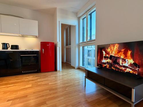 a living room with a fire in the fireplace at Luxury Suites Rotermanni 5 by Rikas Hotels in Tallinn