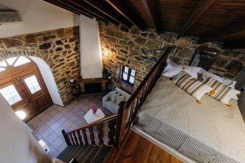 an overhead view of a room with a staircase in a building at Rustic Kampos House Retreat in Chios
