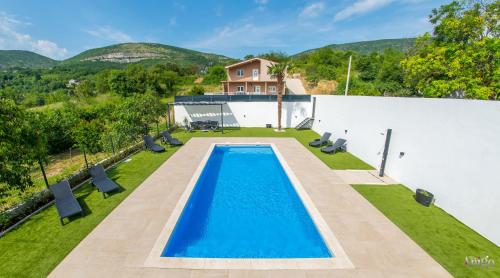 an overhead view of a swimming pool in a yard at Villa Amor in Mostar