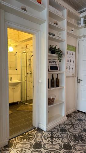 a bathroom with a walk in shower and a sink at Venezia in Haapsalu