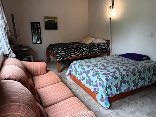 เตียงในห้องที่ Depa Tequis