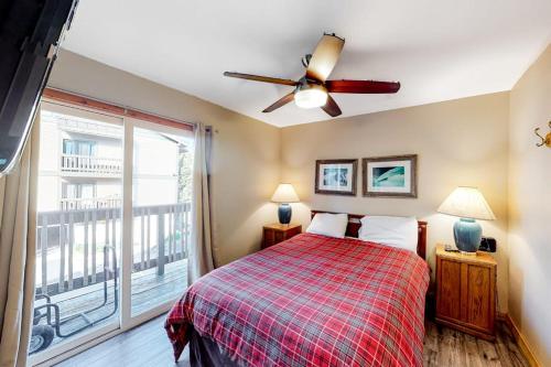 a bedroom with a bed and a ceiling fan at Crestview 48 in Mammoth Lakes