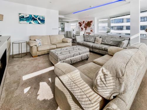 a living room with two couches and a couch at The Beach House in Worthing