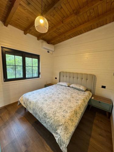 a bedroom with a large bed in a room at Vila KEY-A in Borsh