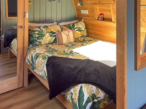 a bed in a small room with a bed in a cabin at The Appleton - Ukc9283 in Brompton