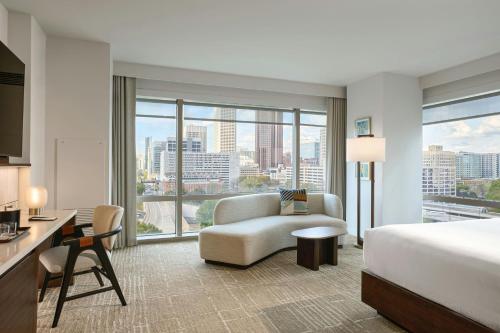 a hotel room with a bed and a large window at JW Marriott Atlanta Downtown in Atlanta
