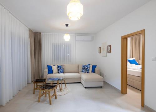 a living room with a couch and a table at Artemis Escape Suites Srebrno Jezero in Veliko Gradište