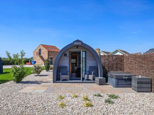 a dome house with a patio in a yard at The Rounton - Ukc9284 in Brompton