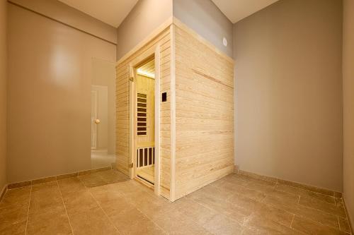a room with a wooden wall and a door at Boka Bay by MN Property in Dobrota