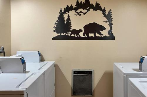 a bathroom with a bear and cub sticker on the wall at Sunrise 8 in Mammoth Lakes