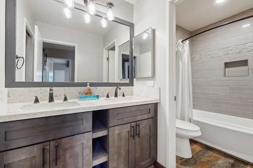 a bathroom with a sink and a toilet and a mirror at St. Moritz 13 in Mammoth Lakes