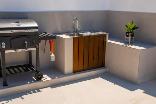 a small kitchen with a sink and a stove at CASA Terraya in Afantou