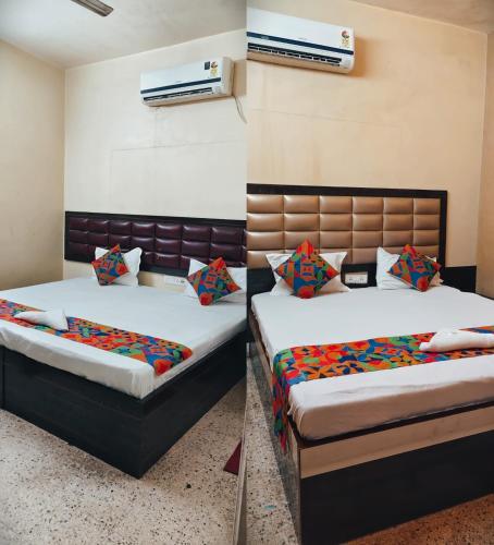 a bedroom with two beds and a air conditioner at A2 Guest House in Salt Lake City