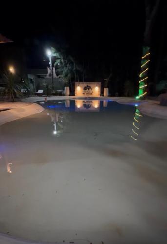 a blurry picture of a street at night at Complejo del jaguel Reserva del Bosque in Santa Teresita