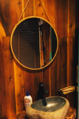 a bathroom with a sink with a mirror above it at Đàng Trong Home 2 in Xóm Rạch Rô