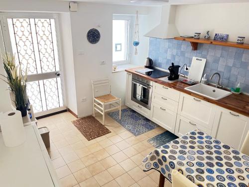 a kitchen with a sink and a counter top at Casa Il Muro in Citta' Sant'Angelo