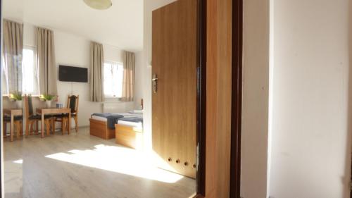 an open door to a room with a living room at Baltic Resort - Korsarz in Darłowo