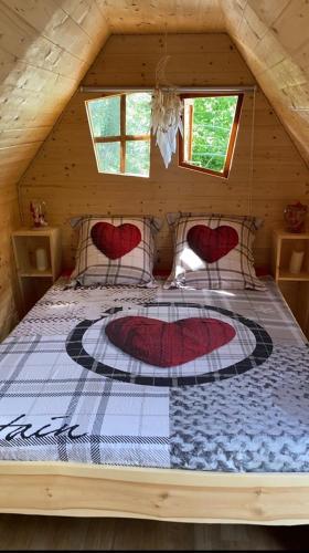 a bedroom with a bed in a log cabin at La cabane escagassée in Grambois