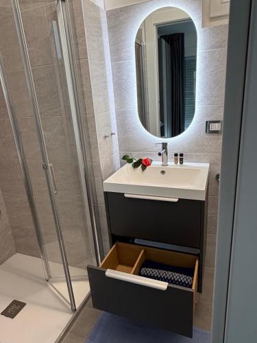 a bathroom with a sink and a mirror at Lakeview in Luino