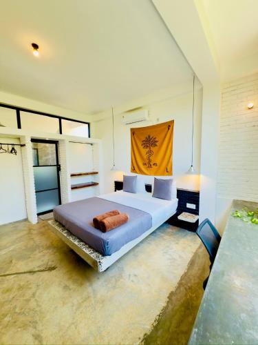 a bedroom with a large bed in a room at REZ SPACE Apartment 03 in Dickwella
