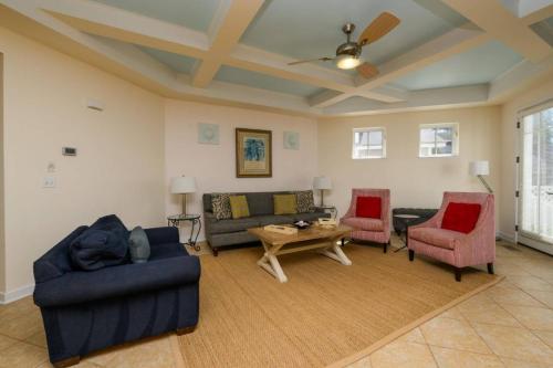 a living room with couches and a table and chairs at 216 New Castle St, Rehoboth Beach in Rehoboth Beach