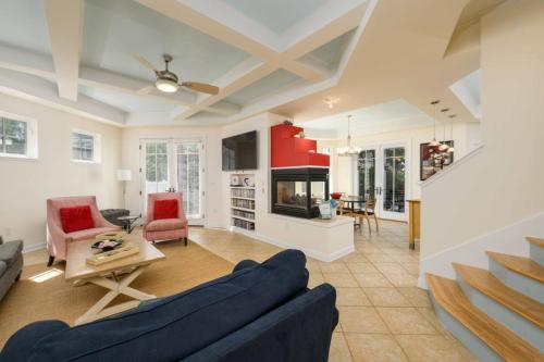 a living room with a blue couch and a table at 216 New Castle St, Rehoboth Beach in Rehoboth Beach