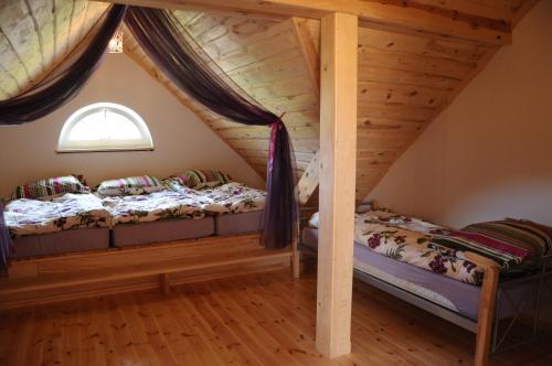 Postel nebo postele na pokoji v ubytování Dom Kaszuby