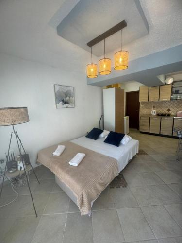 a bedroom with a large bed with two pillows at Jadran5 in Petrovac na Moru
