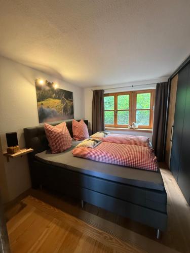 a bedroom with a large bed in a room at Apartment Andal in Lenggries