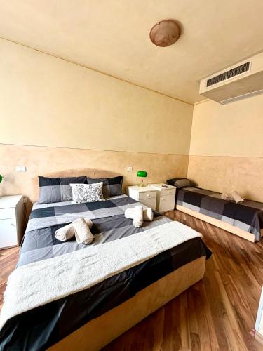 a bedroom with two beds with stuffed animals on it at Diaz 10 Suite in Trieste