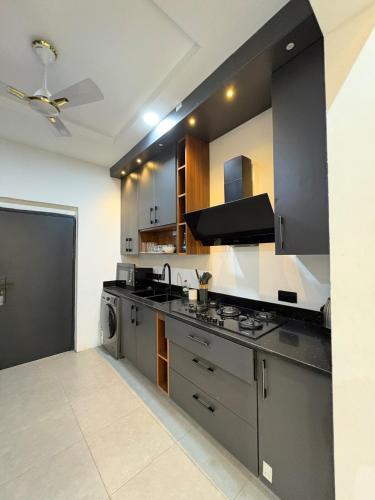a kitchen with stainless steel appliances and a stove at Stay-City Oliver in Apenkwa