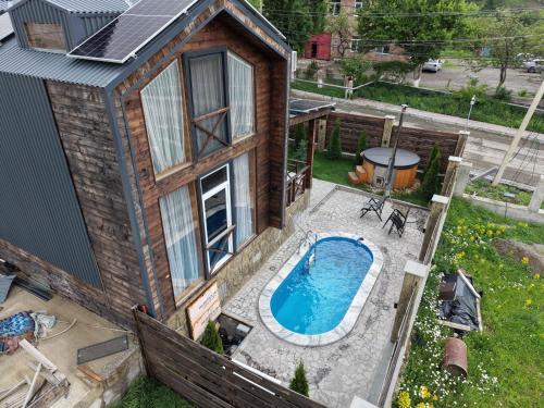 an overhead view of a house with a swimming pool at Swiss House Dilijan in Dilijan