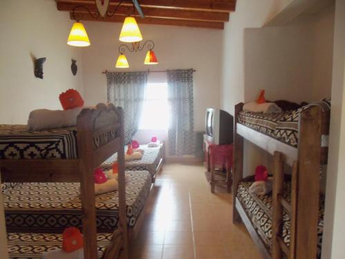 מיטה או מיטות קומותיים בחדר ב-La Casa de Mia Mama