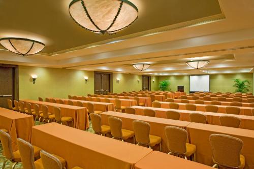an empty lecture hall with tables and chairs at Opal Key Resort & Marina in Key West