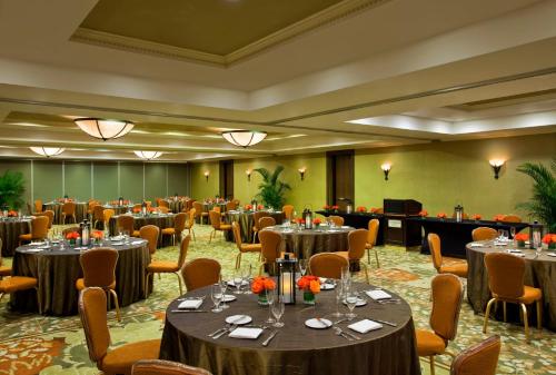a banquet hall with tables and chairs in a room at Opal Key Resort & Marina in Key West